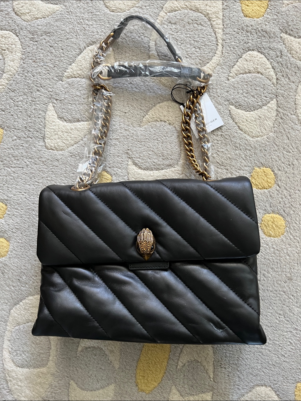Black Quilted Shoulder Bag With Gold Chain And Hand Clasp